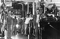 Photo # NH 43476: USS Siboney crewmen in the engine room, December 1918